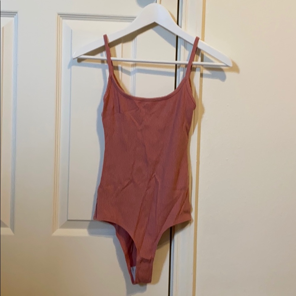 Pink body suit